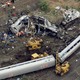 In this Wednesday, May 13, 2015, file photo, emergency personnel work at the scene of a derailment in Philadelphia of an Amtrak train headed to New York. Image credit: Patrick Semansky/Associated Press